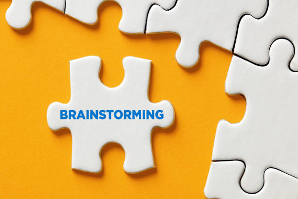 istock The word brainstorming written on a puzzle piece. To find a creative solution by teamwork 1335184693