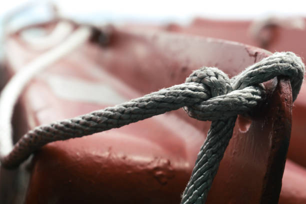 istock Knot rope tied around stake on boat. 1335185725