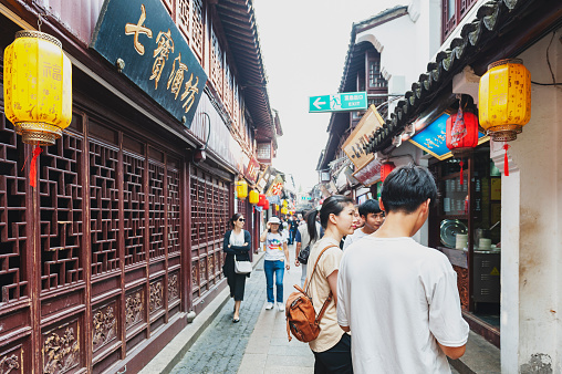 Shanghai, China - September 2019: Buildings and shophouses built in traditional Chinese architecture style located along the Qibao Old Street in Qibao Ancient Town, a historic water township of Qibao in the Minhang District of Shanghai, China