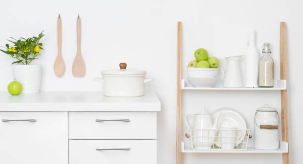 istock Kitchen storage drawers and shelves with ceramic and wooden dishware 1335189598