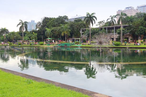 People visit Rizal Park in Ermita District of Manila, Philippines. Metro Manila is one of the biggest urban areas in the world with 24 million people.