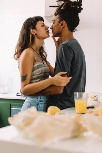 istock Young couple bonding in the kitchen 1335194578
