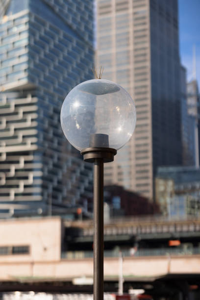 Electric streetlight with an office building background