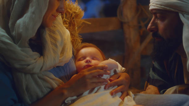 istock Mary and Joseph admiring sleeping baby Jesus 1335197456