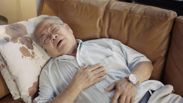 Senior man suffering from asthma stock photo