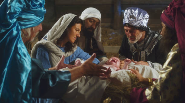 istock Magi and parents speaking over manger with baby Jesus 1335199434