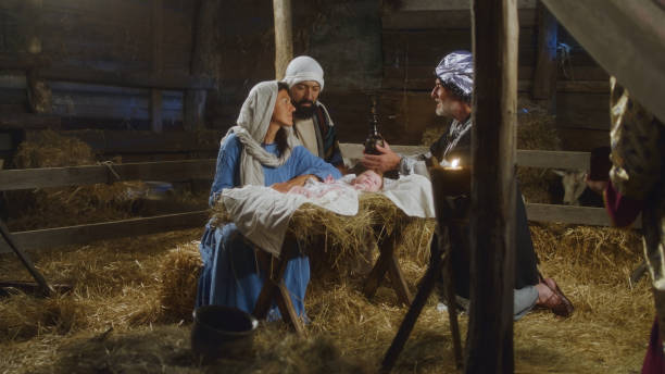 istock Magi giving presents to baby Jesus 1335202534
