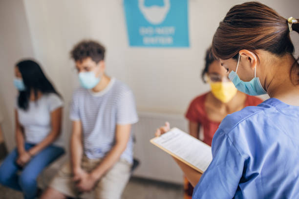 istock People in waiting room at vaccination center 1335202690