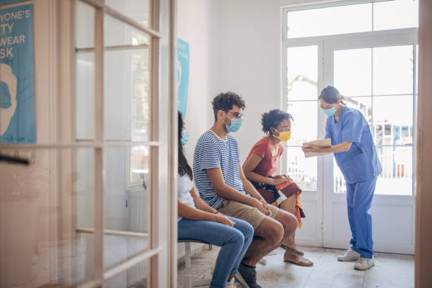 istock People in waiting room at vaccination center 1335203432