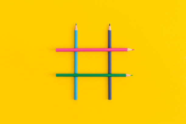 istock Hashtags sign made of colored pencils on yellow background 1335203770