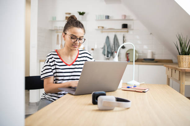 istock Beautiful girl freelancing from home 1335203846