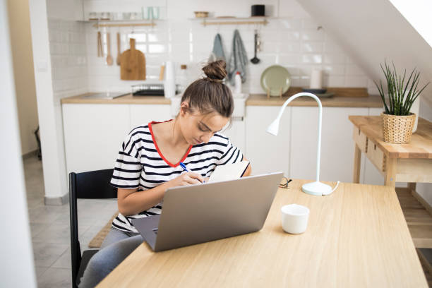 istock Young woman working from the office at her apartment 1335203855