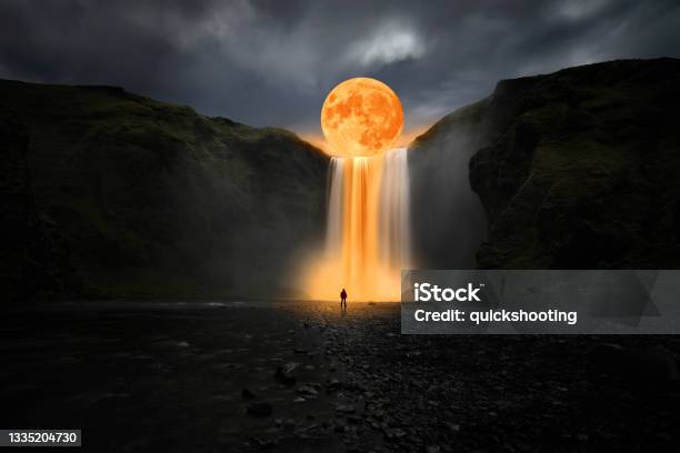 Orange Moon Over Great Waterfall Stock Photo - Download Image Now - Surrealism, Surreal, Waterfall