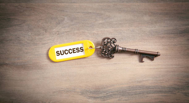 istock Key to success on the wooden background. 1335204744