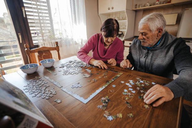 istock Senior couple enjoying leisure time at home 1335204826
