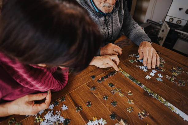 istock Senior couple enjoying leisure time at home 1335204841
