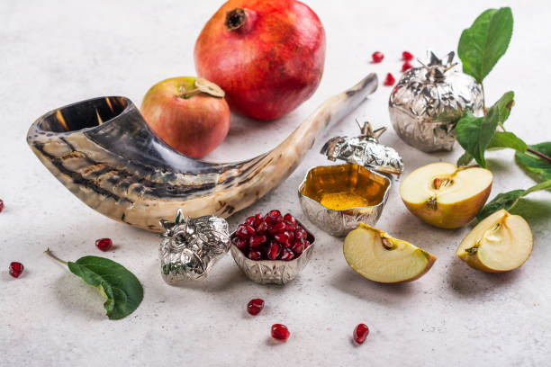 Rosh Hashanah holiday background Happy Rosh Hashanah holiday background. Traditional symbols of jewish New Year - pomegranate, apples, shofar horn and honey. Top view. Copy space orthodox judaism photos stock pictures, royalty-free photos & images