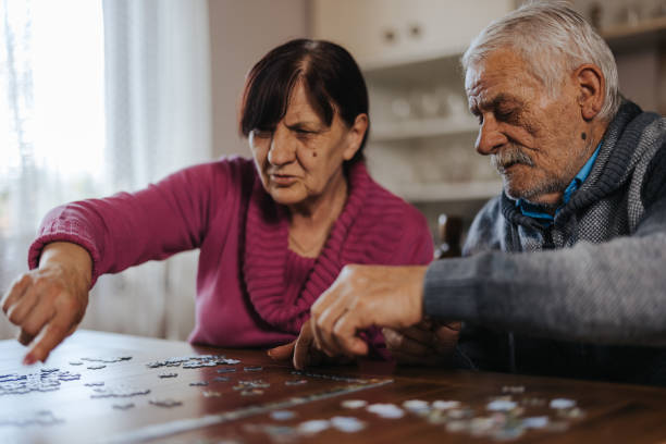 istock Senior couple enjoying leisure time at home 1335204870