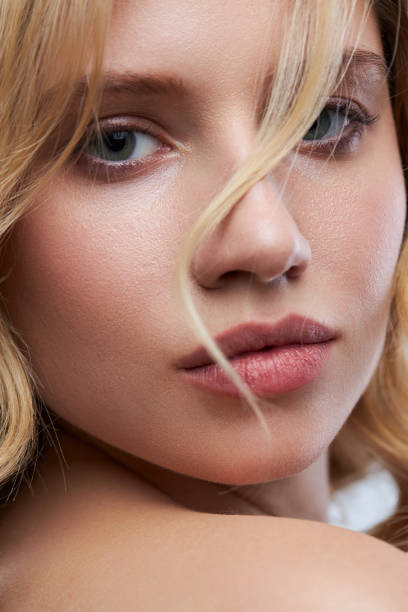 istock Pretty lady with clear skin posing with no makeup. 1335206461
