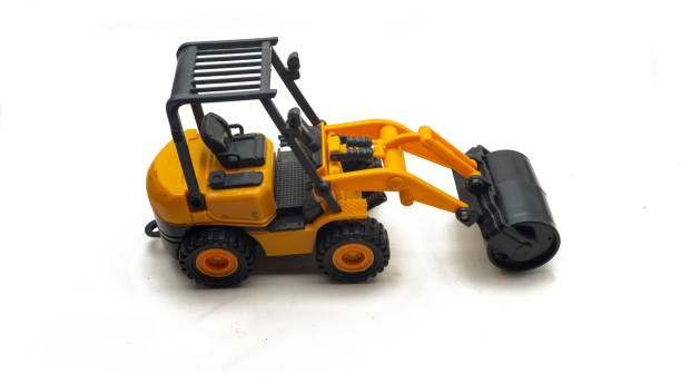 istock Construction machinery yellow road roller kids toy on isolated white background. 1335206597