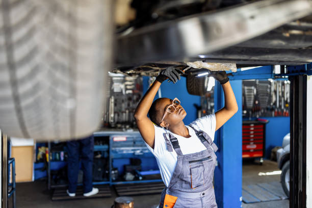 istock African woman as a mechatronics engineer in a car under repair in a car workshop 1335207149