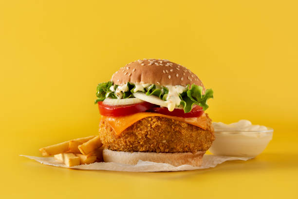 istock Crispy chicken burger with cheese and french fries 1335207151