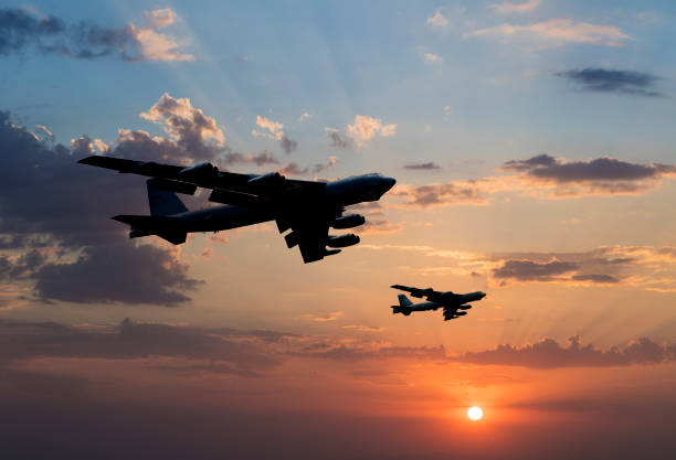 B-52 Bomber Airplanes flying at sunset stock photo