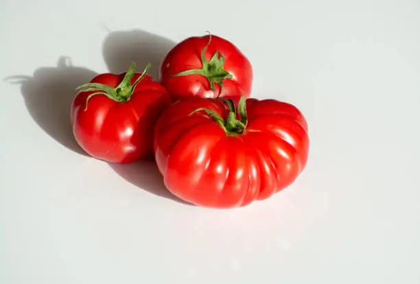 Ripe pink tasty monterosa tomatoes from Spain close up