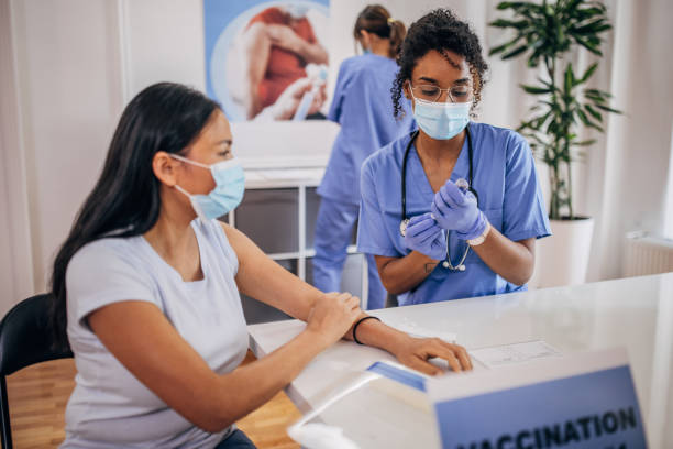 istock Woman receiving a vaccine 1335210105