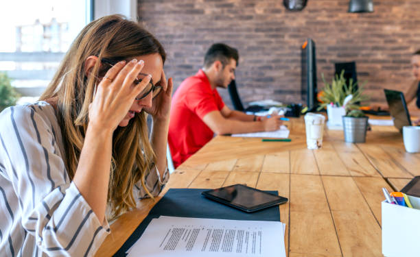 istock Stressed businesswoman with hands on head 1335210577