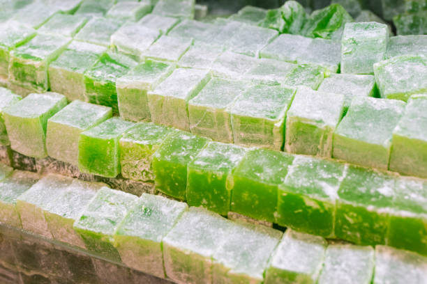 istock Heap of green Turkish delight isolated on white background 1335210773