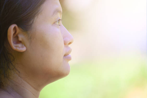 istock Asian white woman side face without makeup.Concept has hope. 1335212519