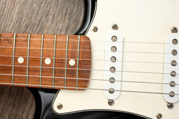 A top down view of the body and neck of an electric guitar.
