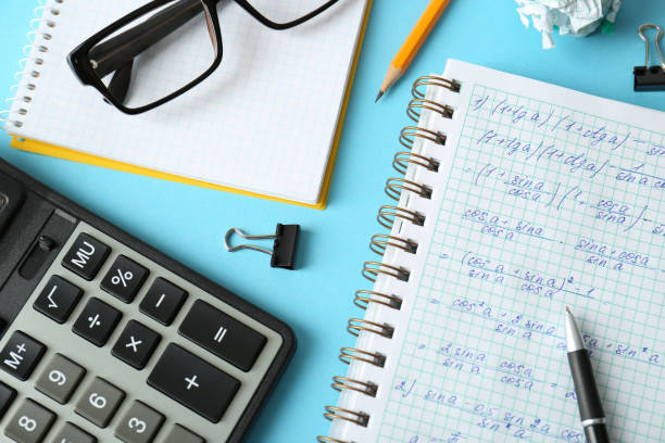 istock Flat lay composition with notebook and stationery on turquoise table. Doing homework 1335215572