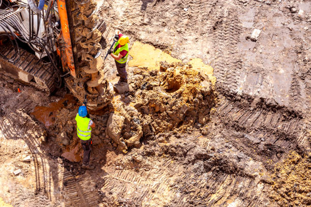 istock Making boreholes with the use of a foundation pile drilling rig 1335218834