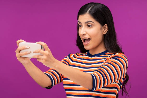 istock Young woman on purple background 1335220752
