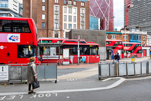 London, United Kingdom- July 27, 2021: Urban scene in London, public transport traffic in front of the train station to Victoria Station.