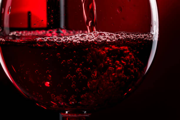 istock Red wine on red black background, abstract splashing. Macro shot 1335229138