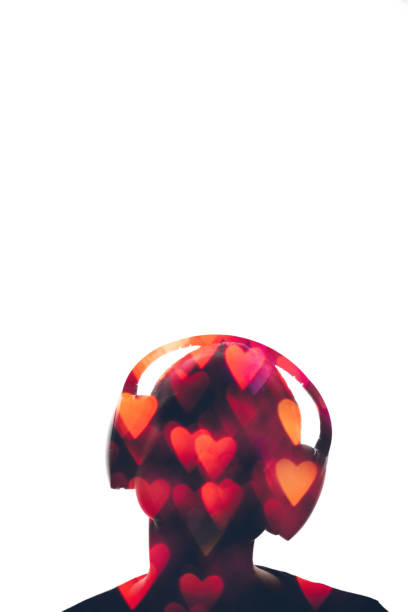 Music lover. Romantic tunes. Valentine song. Double exposure portrait. Abstract glowing red hearts bokeh with man silhouette in headset isolated on white copy space background.