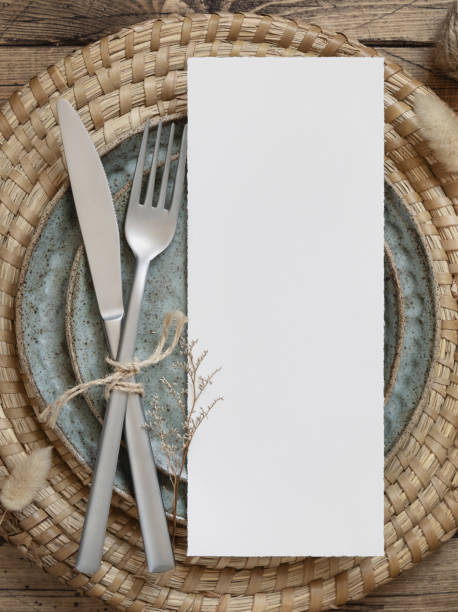 istock Blank paper card on plates with dried plants 1335232044