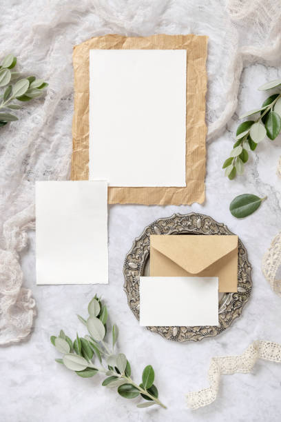 istock Wedding blank cards laying on a marble table decorated with eucalyptus branches 1335232092