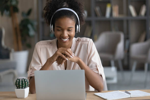 istock Smiling ethnic woman talk on video call on computer 1335240319