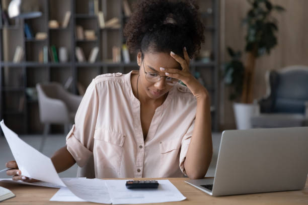 istock Upset ethnic woman distressed with financial problems 1335240358