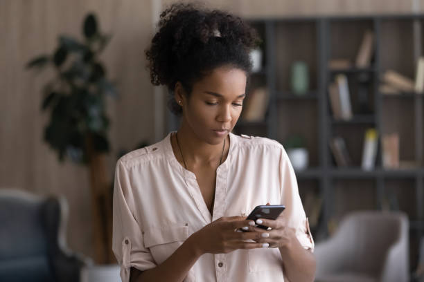 istock African American woman use smartphone texting online 1335240370