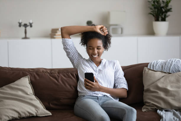 istock Smiling ethnic woman talk on webcam call on smartphone 1335240395