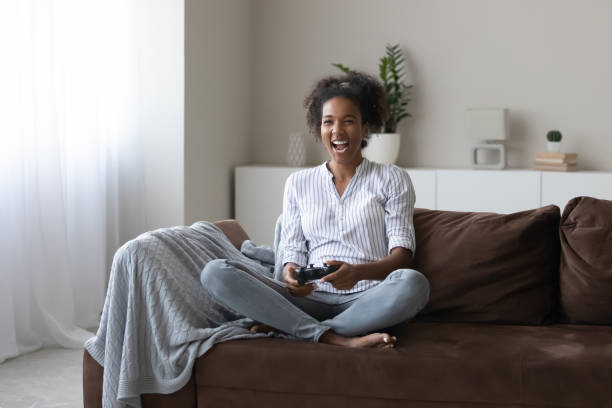 istock Overjoyed African American female play video game 1335240412