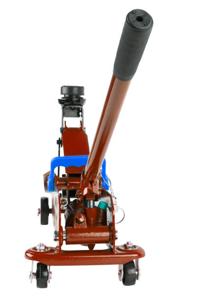 istock red hydraulic car jack isolated on white background, rised up 1335242386