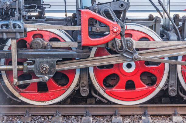 istock Wheels of the retro steam train standing by the platform. 1335248340