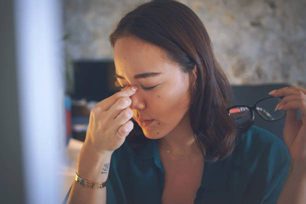 istock Shot of an attractive young woman sitting alone and feeling stressed while using her computer to work from home 1335249718