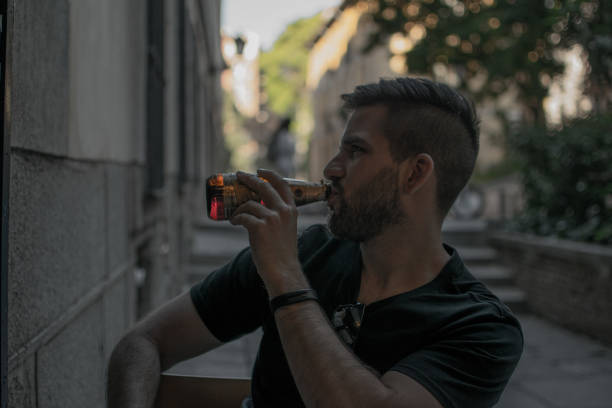 istock young man enjoying a beer in a terrace 1335253768